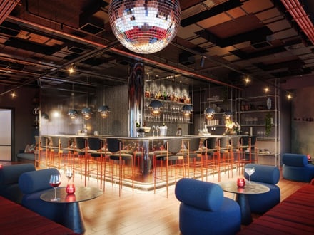 Moderne Bar mit blauen Sitzgelegenheiten und Discokugel.