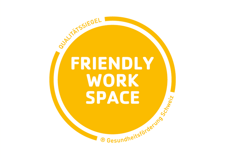 Gelbes Qualitätssiegel 'Friendly Work Space'.